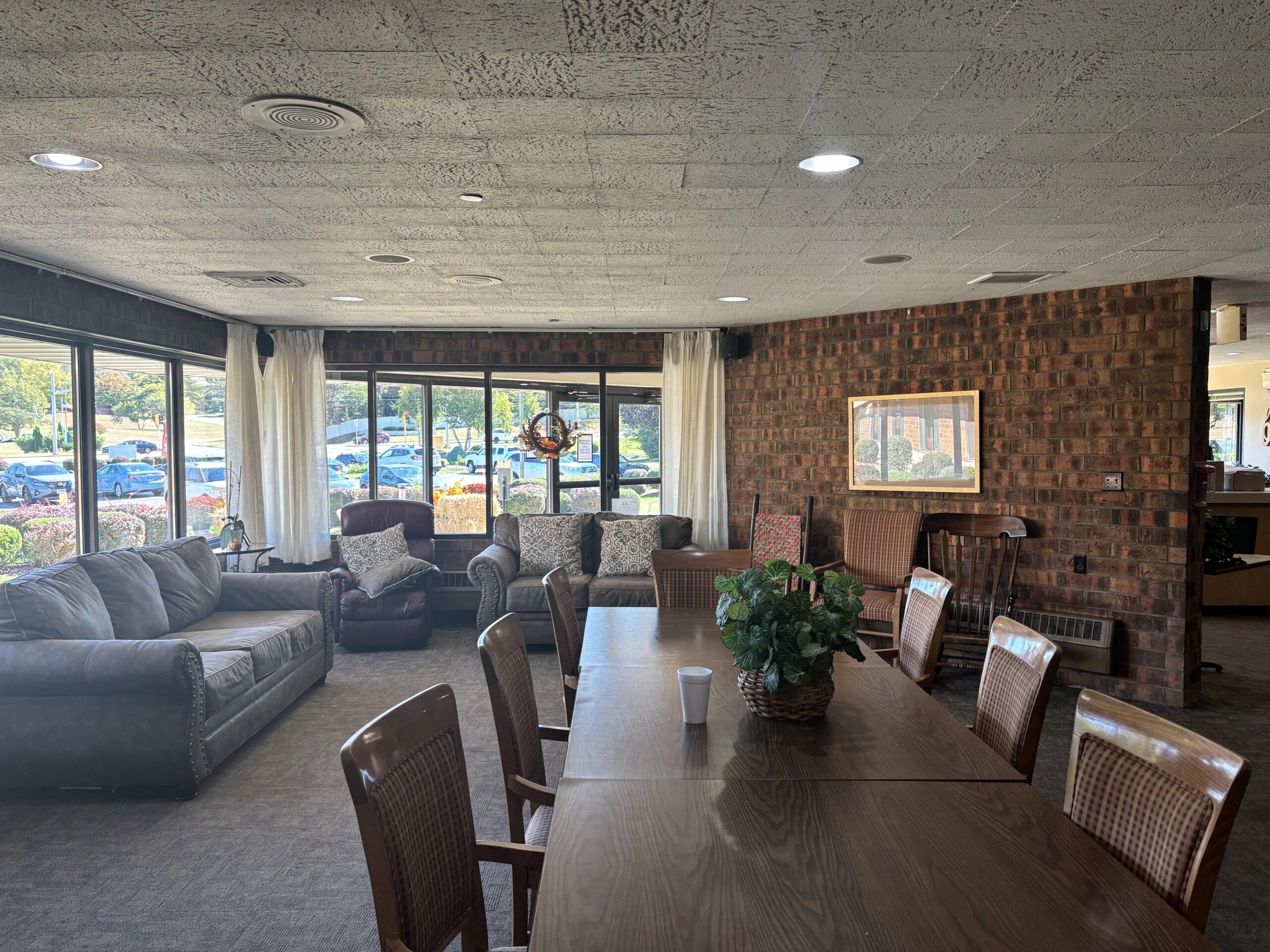 Family helping senior move into assisted living room in Rockford, IL