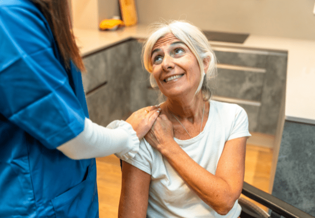 Assisted living resident receiving personal care assistance in Rockford, IL facility